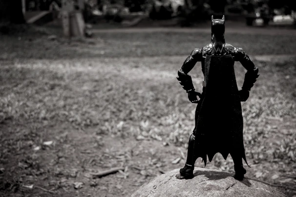 A lively superhero action figure set up in a dynamic cityscape playset.