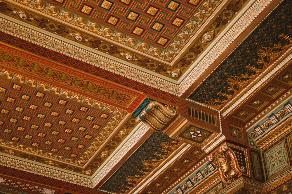 the ceiling of a building with a clock on it