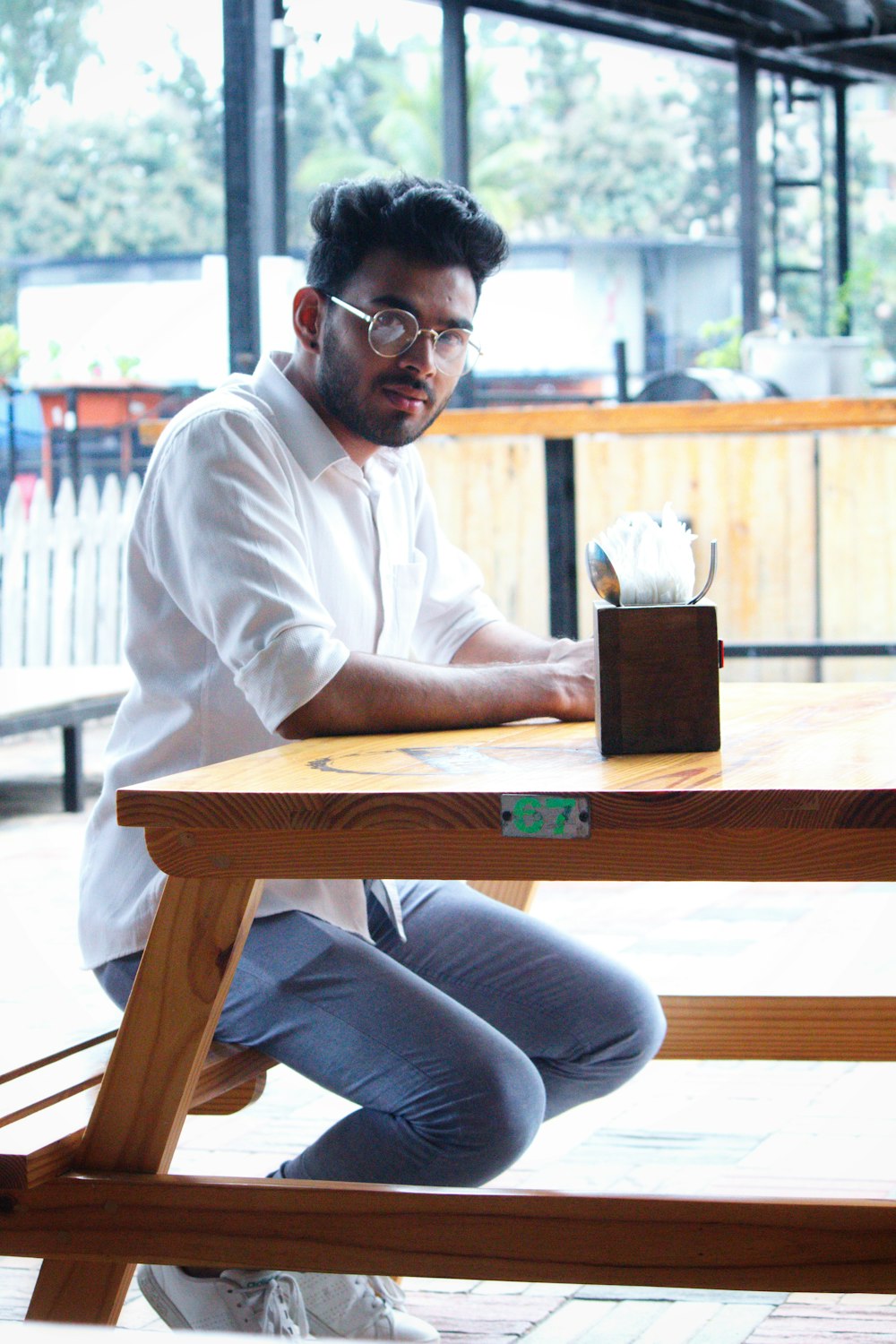 man sitting on a picnic table