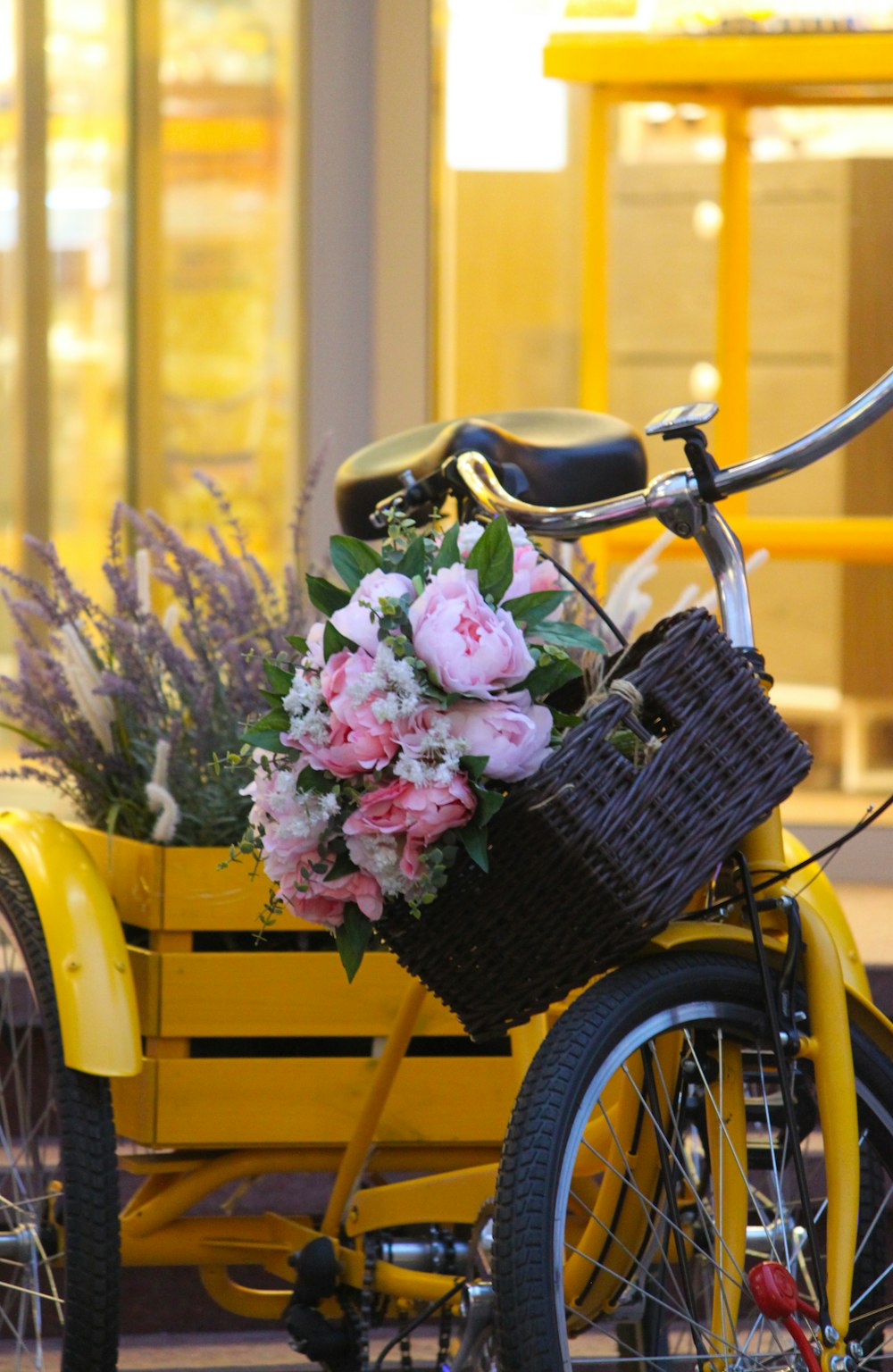 pink petaled flower on wicker basket