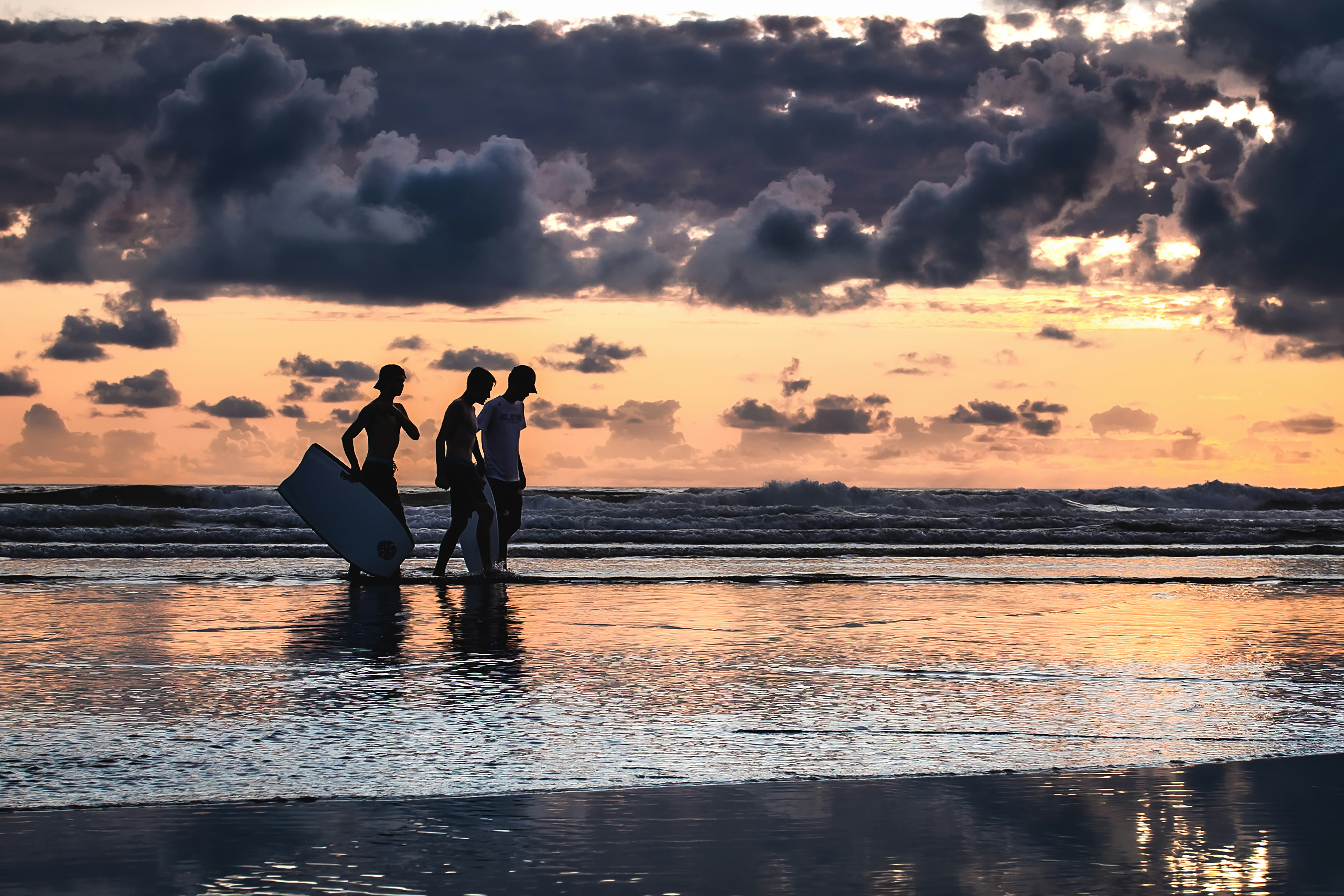 men walking on shore