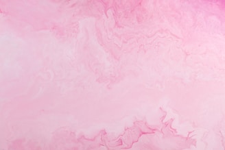 a pink and purple background with a white border