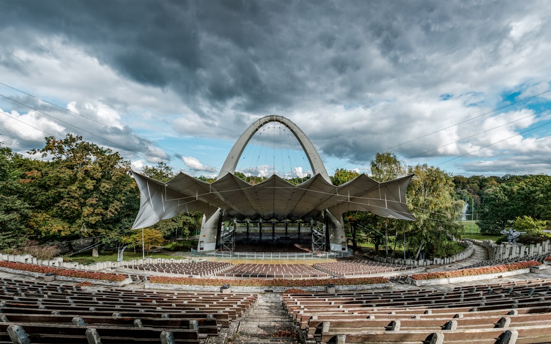 arch shaped stage with empty benches