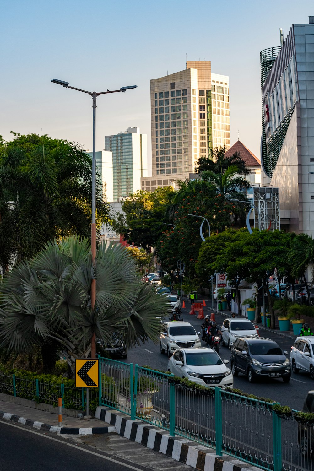 view of traffic at the corner of the street during daytime