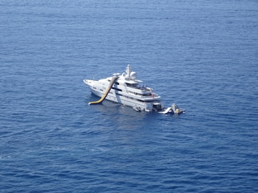 yacht with inflatable slide at the ocean
