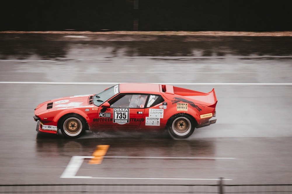 red sports coupe on track