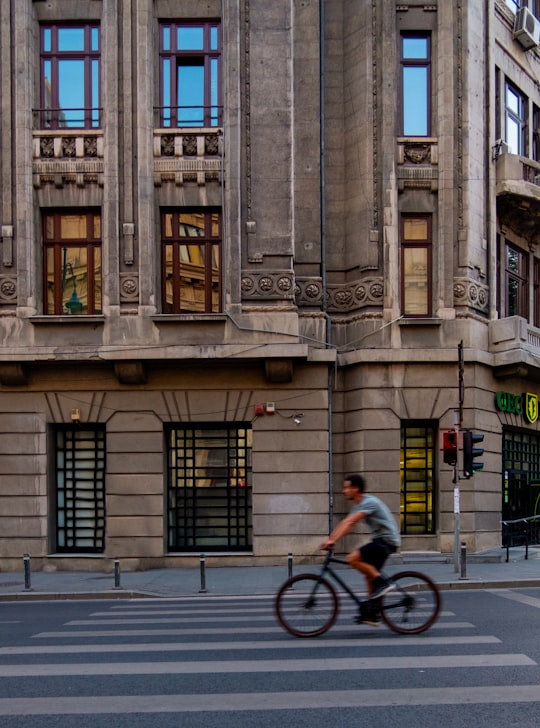 man riding bicycle on pedestrian lane in National Museum of Romanian History Romania