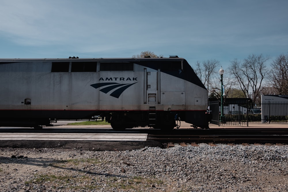 train on railroad during day