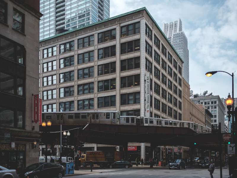 Historic Loop office building with an elevated CTA train passing by, downtown Chicago