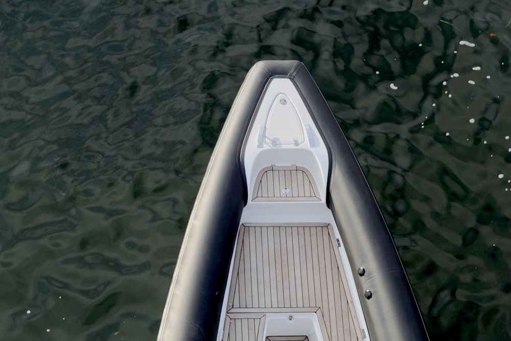 gray boat on body of water during daytime