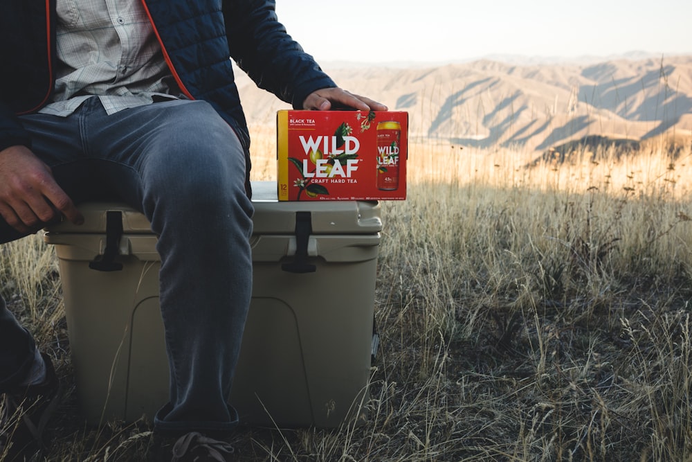 person siting on cooler box