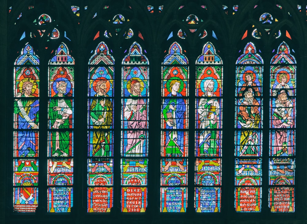 a large stained glass window in a church