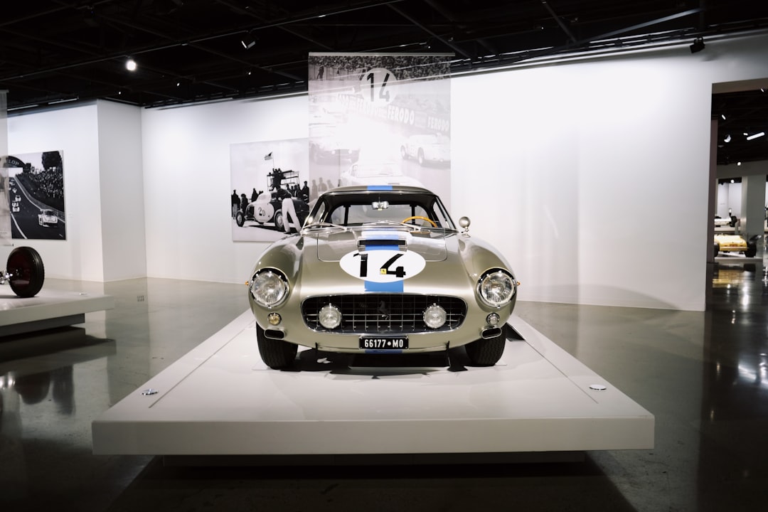 silver Austin-Healey 100 parking inside building