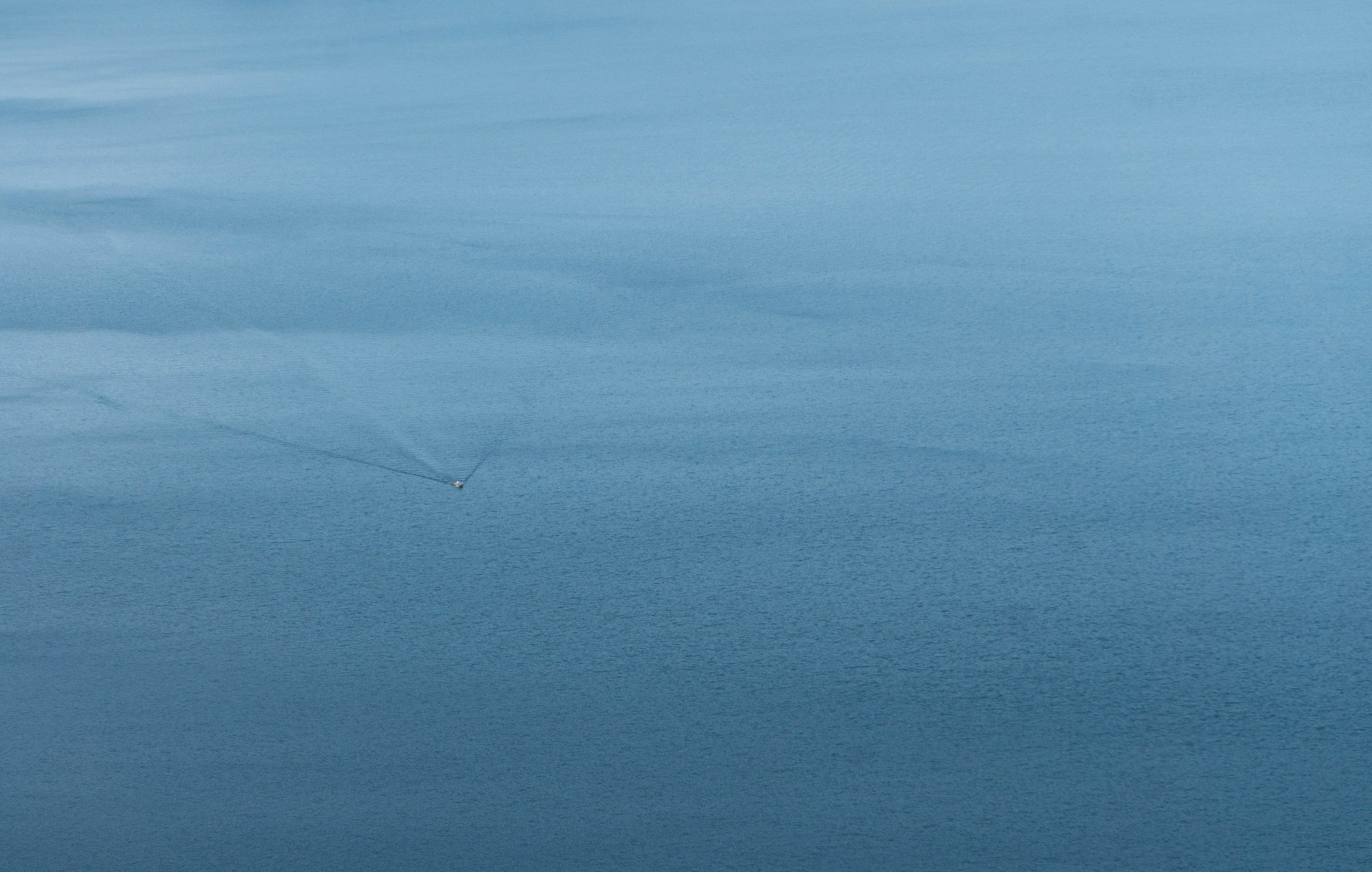 a plane flying over a body of water