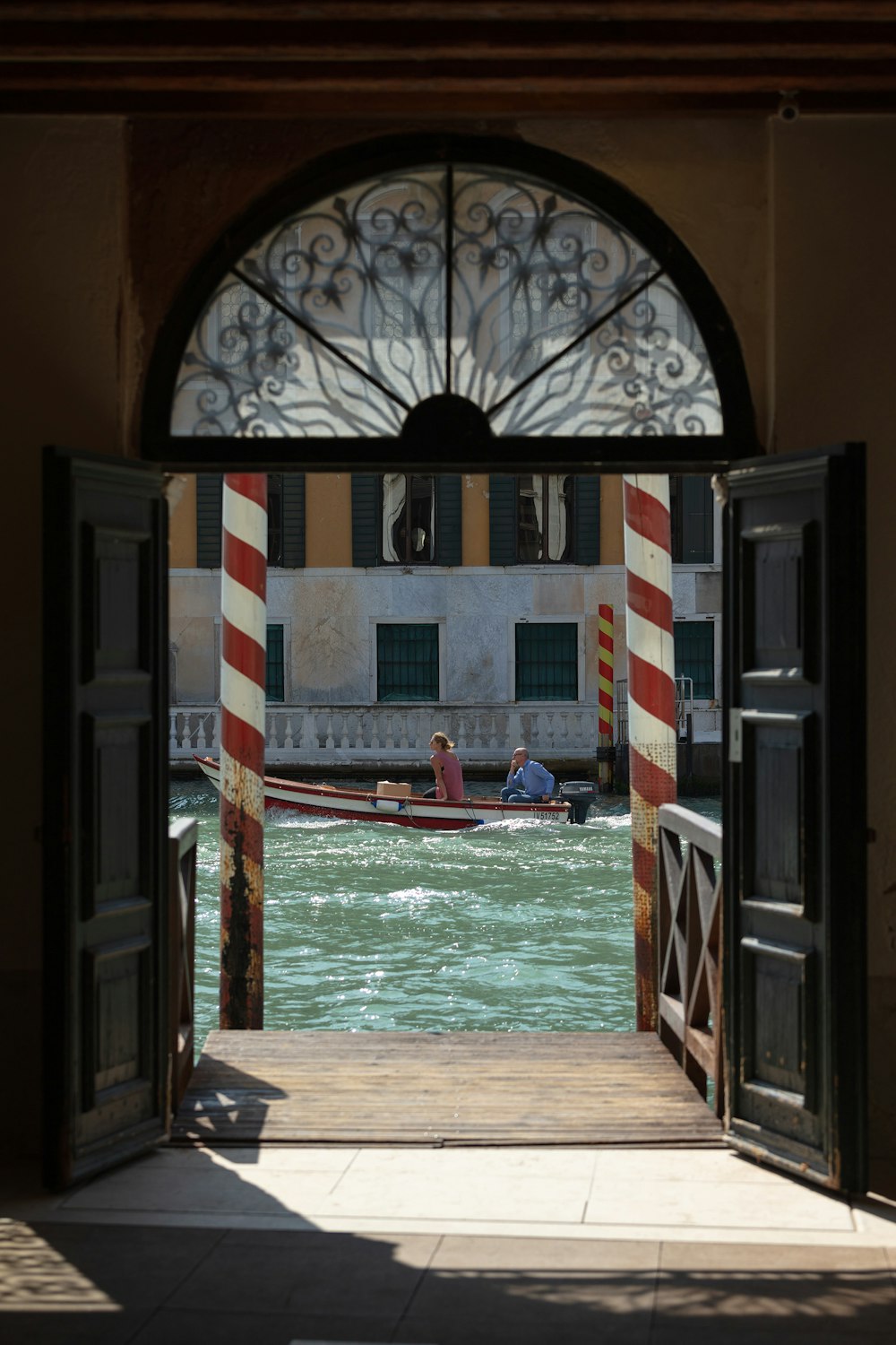 an open door leading to a canal
