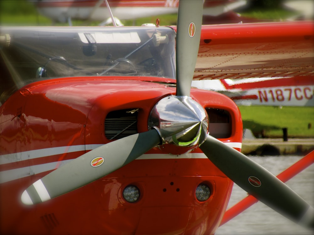 red helicopter at body of water