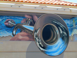 Close-up of a textured canvas featuring a smoky trumpet player blending into an urban night scene