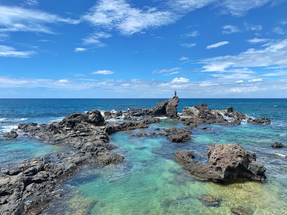 rock formations on body of water