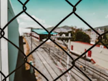 Clear view fencing surrounding a spacious industrial yard.
