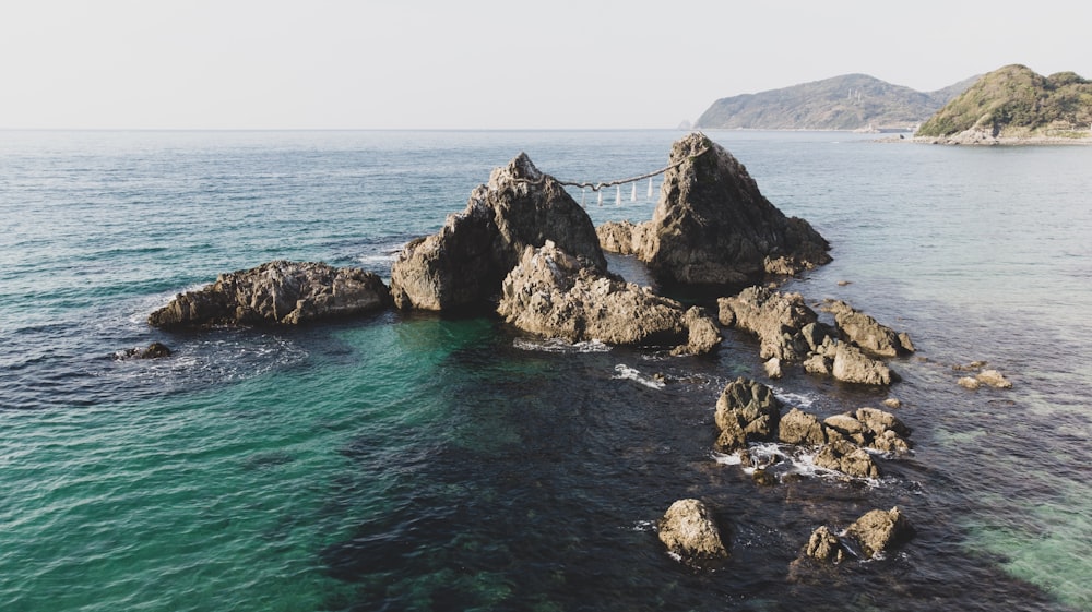 aerial photography of a rock island