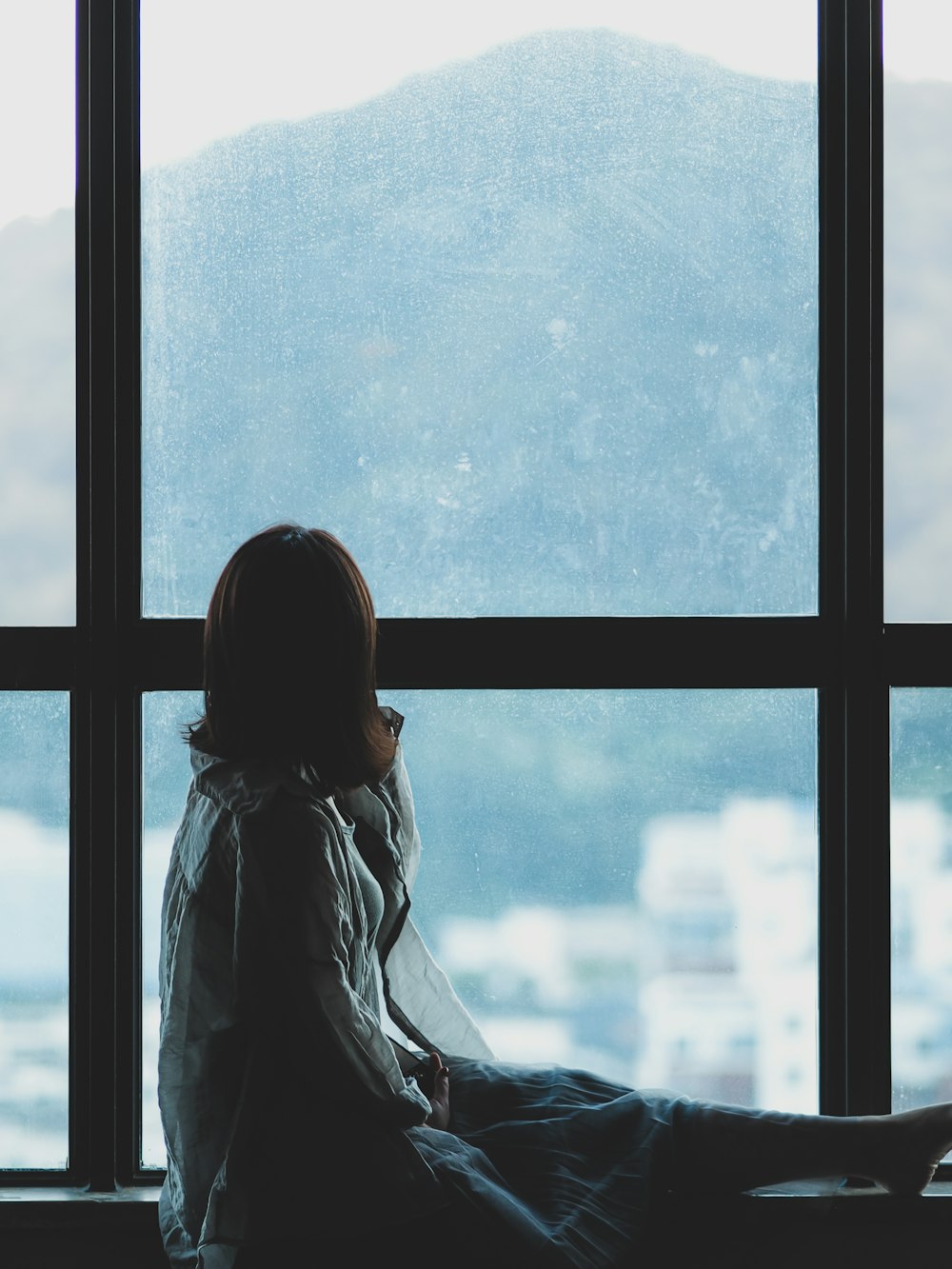 sitting woman facing the city