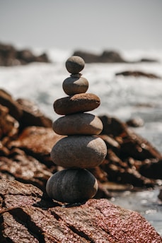 brown and gray stones near body of water