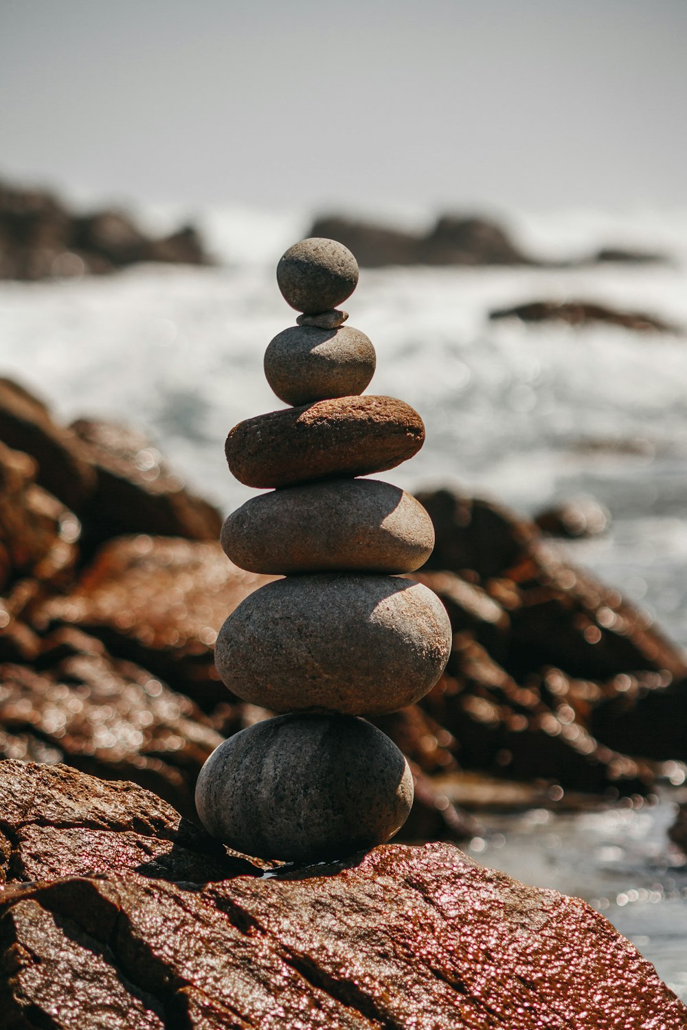 brown and gray stones near body of water