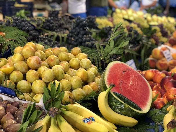A vibrant display of assorted Egyptian fruits in a sunlit orchard.