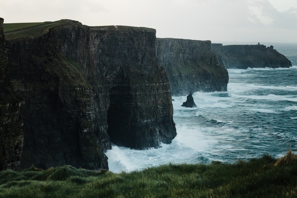 cliffs beside body of water