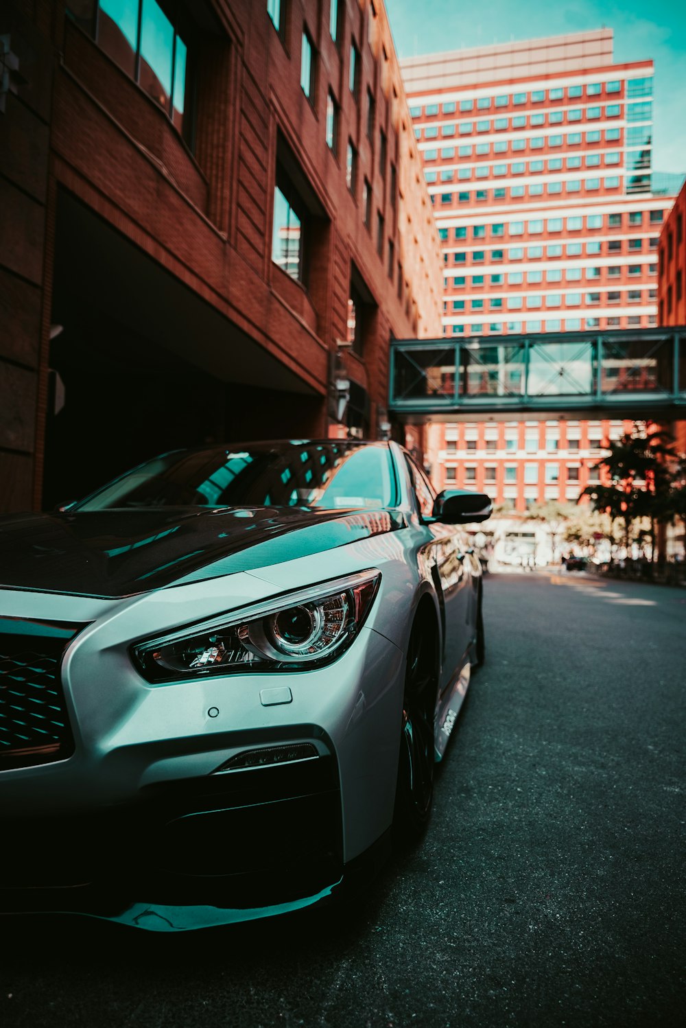 parked silver-colored car during daytime