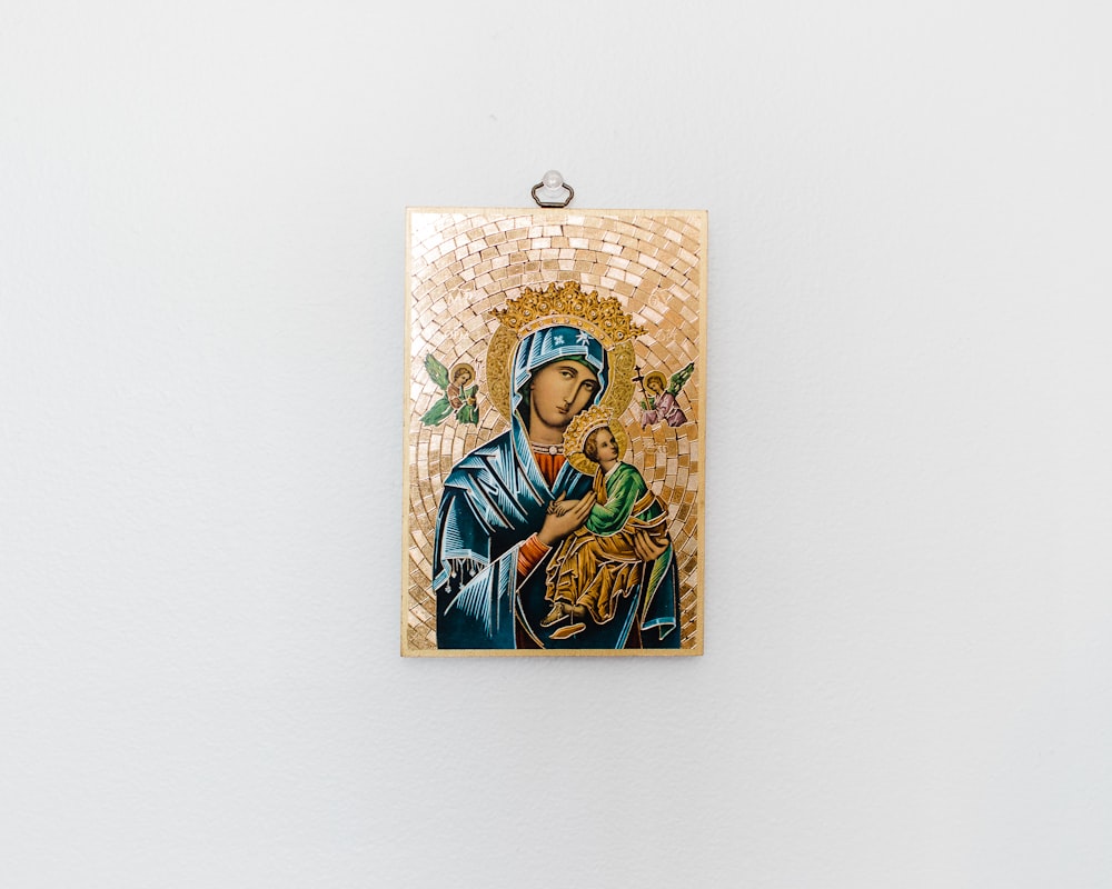 a picture of a religious icon hanging on a wall