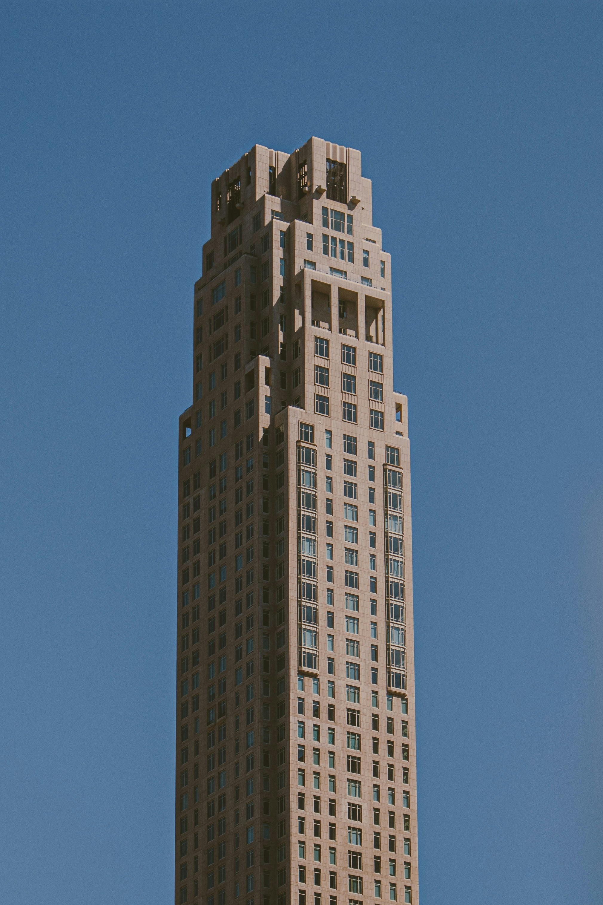 a very tall building with a sky background