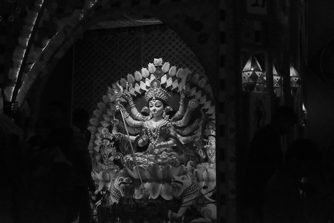 grayscale photography of Durga statue,