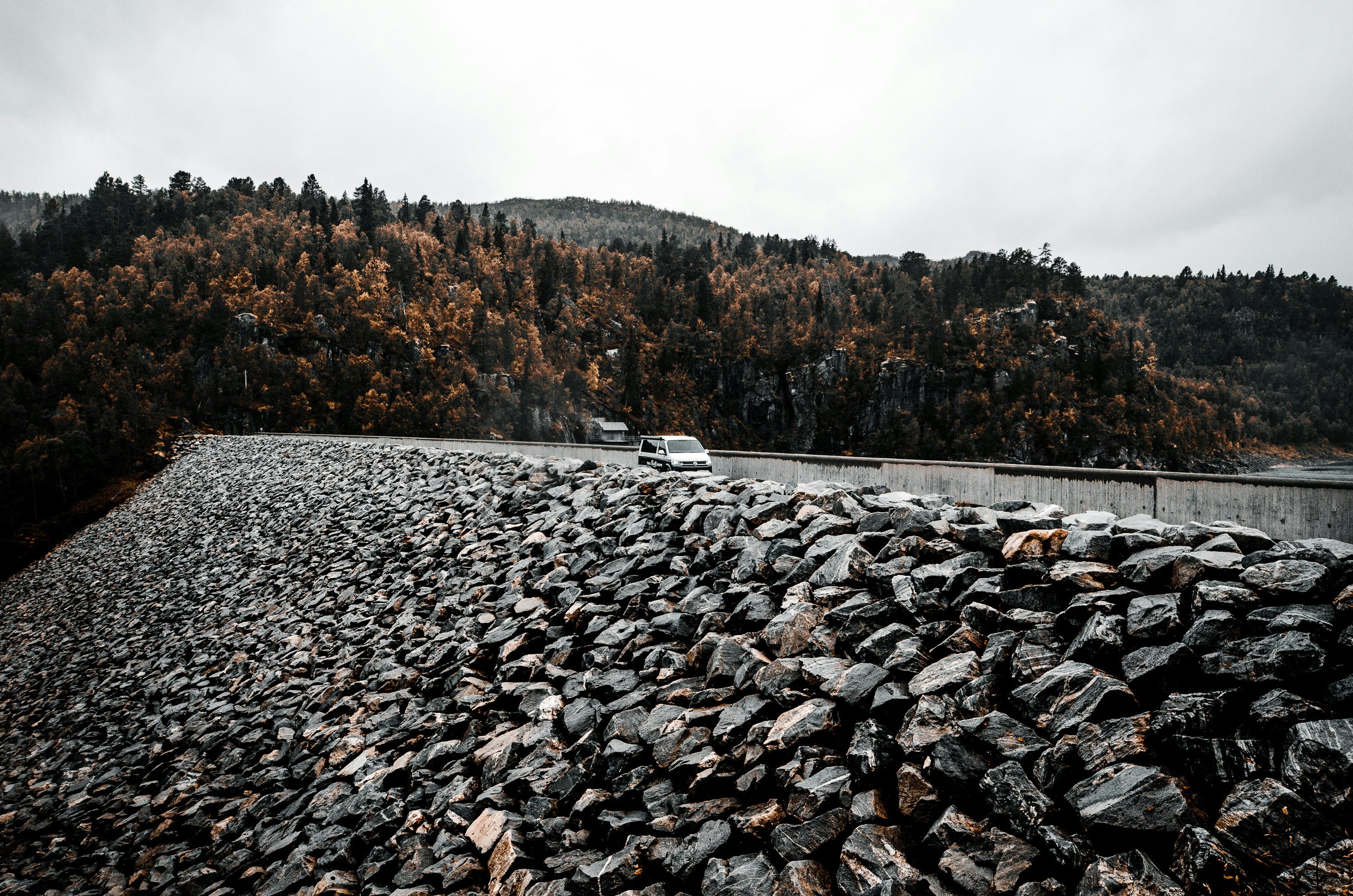a large pile of rocks on the side of a road