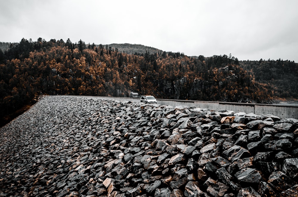 a large pile of rocks on the side of a road