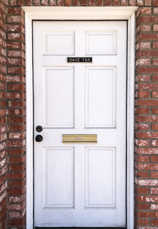 white wooden 4-panel door