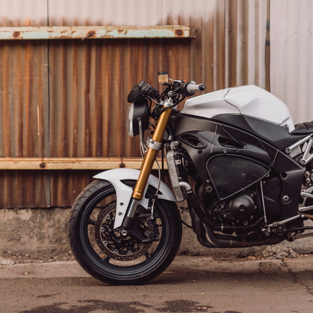 parked white and black motorcycle