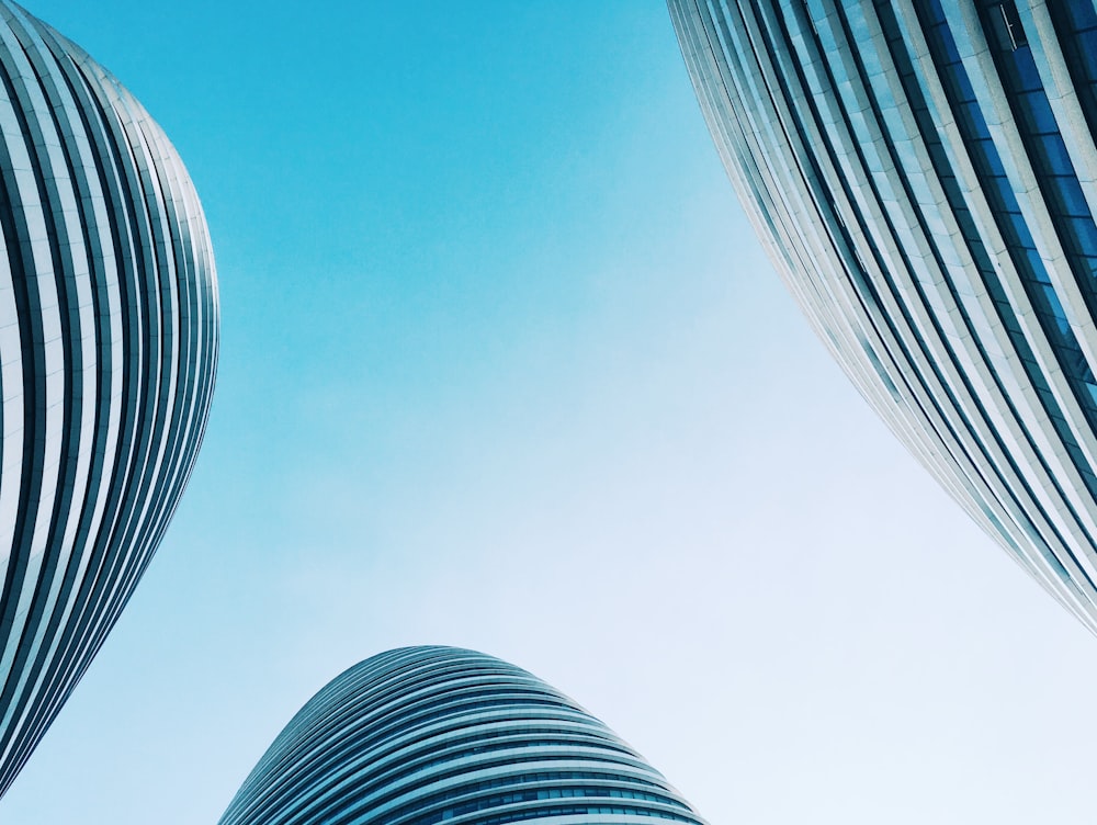 three low angle photography of buildings