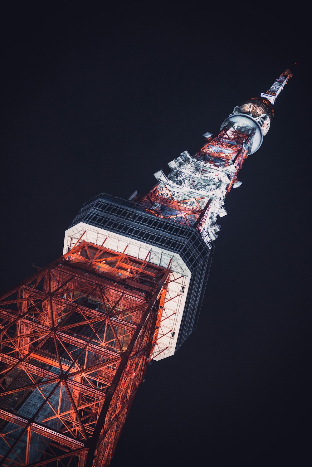 lighted gray tower during nighttime