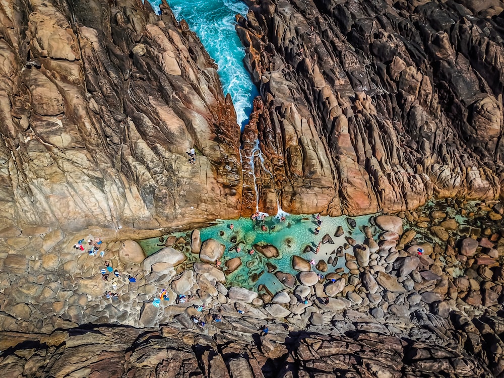 body of water beside rock