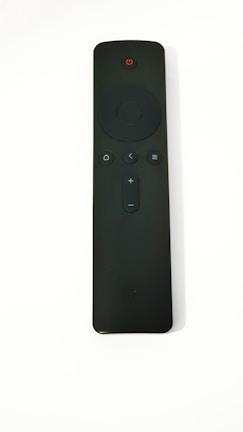 A sleek remote control with smooth buttons and a matte finish.