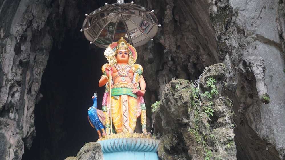 shallow focus photo of Hindu god statue