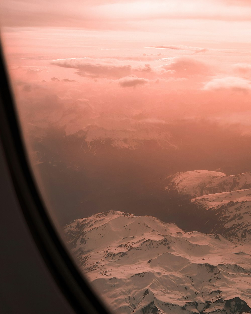 aerial photo of snow covered mountains during daytime