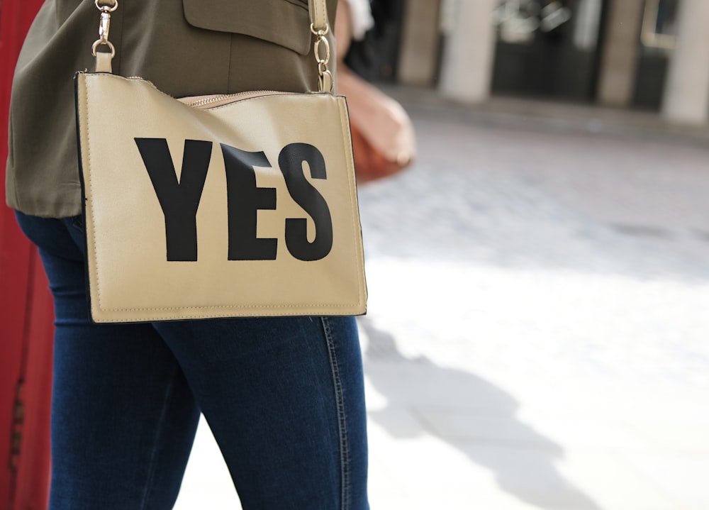 brown yes-printed leather crossbody bag