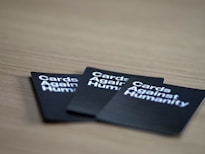 three Card Againsts Humanity cards