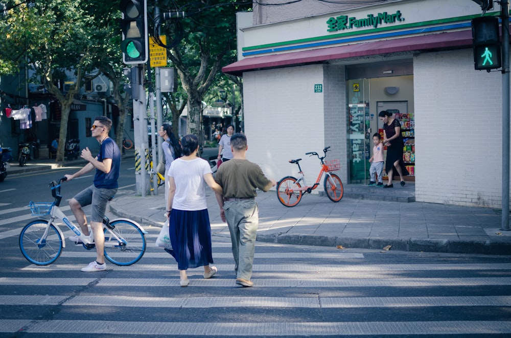 man and woman crossing on road