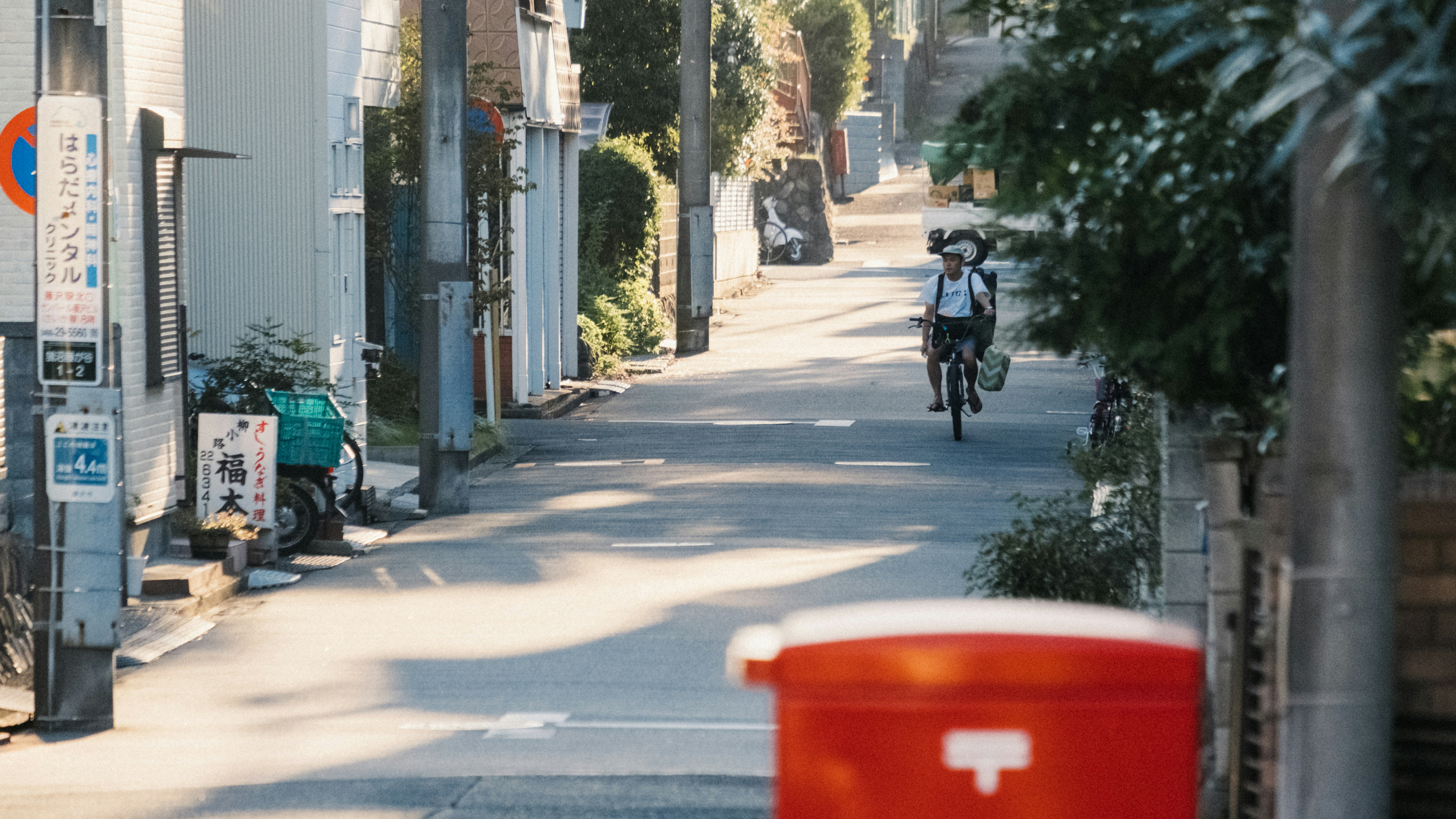 man riding bike near buildings during day