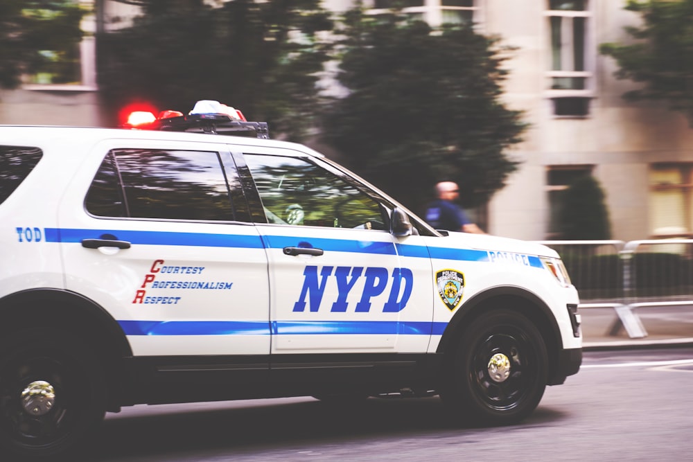 white and blue NYPD SUV