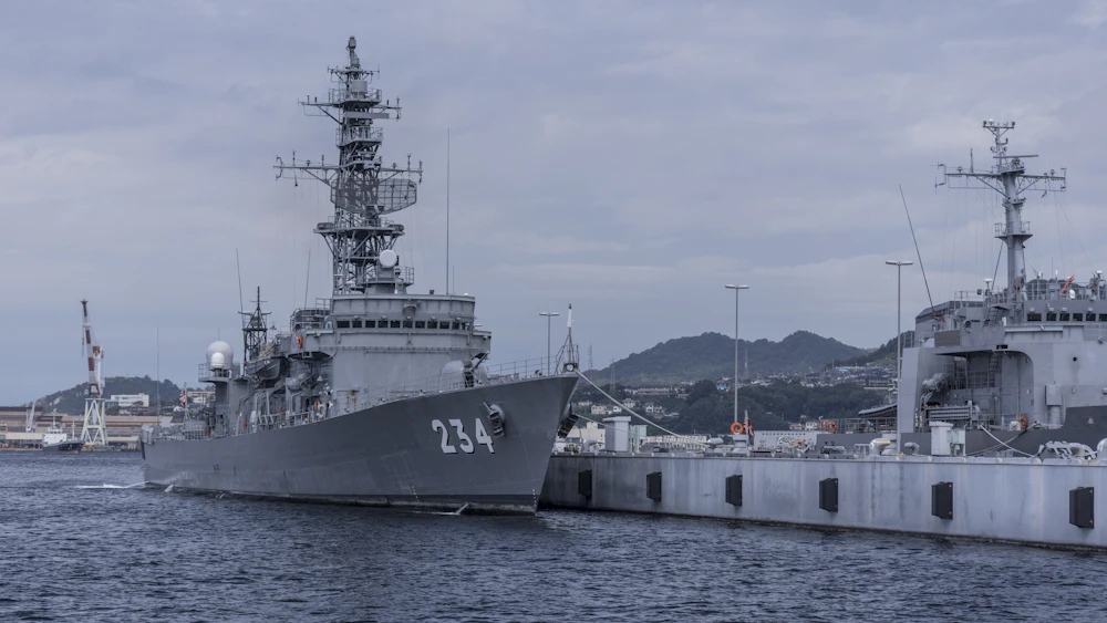 Naval destroyers moored at port