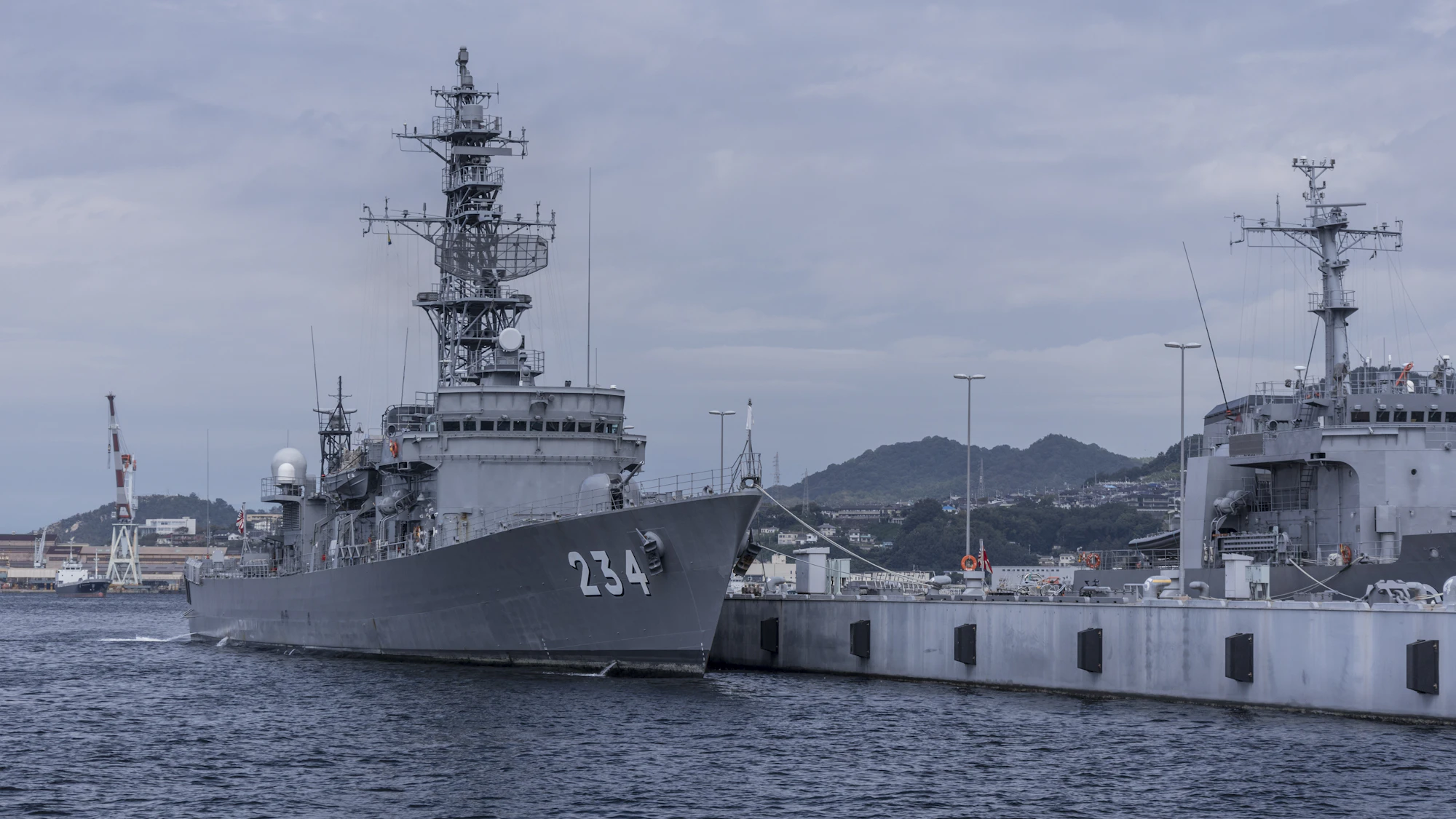 Naval destroyers moored at port
